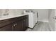 Laundry room with countertop, storage cabinets, sink, and appliances at 4001 Turquoise Falls St, Las Vegas, NV 89129