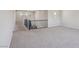 Open living room with carpet and railing at 4001 Turquoise Falls St, Las Vegas, NV 89129
