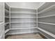 Bright pantry with white shelving, light walls, and wood look flooring at 4001 Turquoise Falls St, Las Vegas, NV 89129