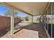 Covered patio with brick pavers and a view of the landscaped backyard at 4001 Turquoise Falls St, Las Vegas, NV 89129
