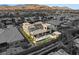 Luxury home has a backyard with pool, spa, covered patio, rooftop solar panels, and desert landscaping at 4208 Lapis Ridge Ct, Las Vegas, NV 89135
