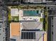 Backyard aerial view features a sparkling pool, spa, lounge chairs, and covered patio, plus rooftop solar panels at 4208 Lapis Ridge Ct, Las Vegas, NV 89135