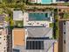 Stunning aerial view of a backyard with a modern pool, spa, patio, solar panels and pristine landscaping at 4208 Lapis Ridge Ct, Las Vegas, NV 89135