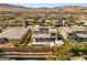Aerial view of a home with pool, solar panels, covered patio with scenic views in a well-kept community at 4208 Lapis Ridge Ct, Las Vegas, NV 89135