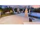 A backyard boasting a luxury outdoor kitchen, fire pit, pool, and meticulously kept landscaping for upscale outdoor living at 4208 Lapis Ridge Ct, Las Vegas, NV 89135