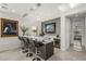 Modern bar area with marble countertops, stylish seating, and a wine refrigerator at 4208 Lapis Ridge Ct, Las Vegas, NV 89135