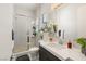 Updated bathroom with a white vanity, shower with glass doors, and modern fixtures at 4208 Lapis Ridge Ct, Las Vegas, NV 89135