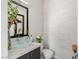 Stylish powder room featuring a unique vessel sink and textured wall at 4208 Lapis Ridge Ct, Las Vegas, NV 89135
