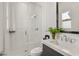 Modern bathroom featuring a glass-enclosed shower with white textured tile and sleek fixtures at 4208 Lapis Ridge Ct, Las Vegas, NV 89135