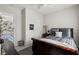 Bedroom with wood floors, full-sized bed, and modern decor at 4208 Lapis Ridge Ct, Las Vegas, NV 89135