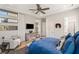 Bright primary bedroom with sitting area, ceiling fan, and recessed lighting at 4208 Lapis Ridge Ct, Las Vegas, NV 89135