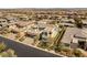 Gorgeous exterior shot of a modern home with a manicured lawn and a desert landscaped yard at 4208 Lapis Ridge Ct, Las Vegas, NV 89135