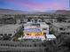 Amazing modern home featuring a pool, solar panels, covered patio with mountain views in a desert community at 4208 Lapis Ridge Ct, Las Vegas, NV 89135