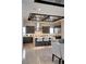 Modern kitchen features an island, stainless steel appliances, and unique drop-lighting at 4208 Lapis Ridge Ct, Las Vegas, NV 89135
