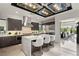 Modern kitchen featuring a large center island, stainless steel appliances, and gray tone cabinetry at 4208 Lapis Ridge Ct, Las Vegas, NV 89135