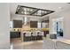 Gourmet kitchen boasts an oversized island, stainless steel appliances, and custom cabinetry at 4208 Lapis Ridge Ct, Las Vegas, NV 89135