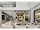 Bright living room featuring high ceilings, modern staircase, and an open floor plan at 4208 Lapis Ridge Ct, Las Vegas, NV 89135