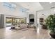 Bright and open living room with a fireplace, bar, and sliding doors to the patio at 4208 Lapis Ridge Ct, Las Vegas, NV 89135