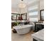 Stylish main bathroom with freestanding tub, dual vanities, and elegant design for ultimate relaxation at 4208 Lapis Ridge Ct, Las Vegas, NV 89135