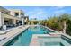 A beautifully landscaped pool area with a modern pool and outdoor living space at 4208 Lapis Ridge Ct, Las Vegas, NV 89135