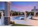 A luxurious pool and patio area with cactus and a sculpture, perfect for entertaining at 4208 Lapis Ridge Ct, Las Vegas, NV 89135