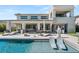 A luxurious pool and patio area with an outdoor seating area, perfect for entertaining at 4208 Lapis Ridge Ct, Las Vegas, NV 89135