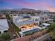 Luxury home showcasing a pool, covered patio and solar panels against a mountain backdrop at 4208 Lapis Ridge Ct, Las Vegas, NV 89135