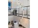 Bright modern staircase with pendant lighting for a unique and stylish focal point at 4208 Lapis Ridge Ct, Las Vegas, NV 89135