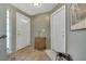 Bright entryway with wood-style flooring and a decorative front door with sidelight at 4343 Sharpshooter Ln, North Las Vegas, NV 89031