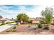 Lovely single-story home showcasing xeriscaping and a well-maintained lawn, offering curb appeal and easy care at 4343 Sharpshooter Ln, North Las Vegas, NV 89031