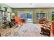 Bright living room with sliding doors to the pool, stylish decor, and comfortable seating, perfect for relaxing or entertaining at 4343 Sharpshooter Ln, North Las Vegas, NV 89031