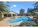 The large in-ground pool features a jacuzzi and mature landscaping, ideal for outdoor relaxation and entertainment at 4343 Sharpshooter Ln, North Las Vegas, NV 89031