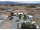Aerial view of a mobile home park with mountain views in the distance on a sunny day at 4861 Pahrump Valley Blvd, Pahrump, NV 89048