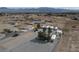 Aerial view of a mobile home park surrounded by desert landscape and mountain views on a sunny day at 4861 Pahrump Valley Blvd, Pahrump, NV 89048