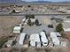 Aerial view of a mobile home park with RV lots, mature trees, and a desert landscape at 4861 Pahrump Valley Blvd, Pahrump, NV 89048