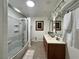 Bright bathroom with a jacuzzi tub, dual vanity and elegant mirror lighting at 4861 Pahrump Valley Blvd, Pahrump, NV 89048