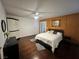 Bedroom features hardwood floors, and light walls creating a cozy atmosphere at 4861 Pahrump Valley Blvd, Pahrump, NV 89048