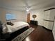 Bright bedroom with hardwood floors and a ceiling fan at 4861 Pahrump Valley Blvd, Pahrump, NV 89048
