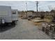 Exterior shot of a mobile home park featuring several lots, a shed, and desert landscaping at 4861 Pahrump Valley Blvd, Pahrump, NV 89048