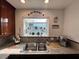 Kitchen sink offers a bright view of the outdoors at 4861 Pahrump Valley Blvd, Pahrump, NV 89048