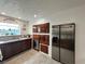 Modern kitchen boasts stainless steel refrigerator, dishwasher and dark wood cabinetry at 4861 Pahrump Valley Blvd, Pahrump, NV 89048