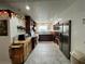 Spacious kitchen features abundant cabinetry, stainless steel appliances, and tiled floors at 4861 Pahrump Valley Blvd, Pahrump, NV 89048