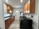 Well-lit laundry room with washer, dryer, ample cabinet space, sink, and sleek countertop for added convenience at 4861 Pahrump Valley Blvd, Pahrump, NV 89048