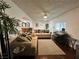 Comfortable living room with hardwood floors, ceiling fan, neutral furniture, and lots of natural light at 4861 Pahrump Valley Blvd, Pahrump, NV 89048