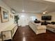 Bright living room boasts hardwood floors, neutral furnishings, and lots of natural light at 4861 Pahrump Valley Blvd, Pahrump, NV 89048