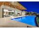 Backyard featuring a modern pool, tiled patio, floor to ceiling glass walls, and outdoor dining area at 49 Crested Cloud Way, Las Vegas, NV 89135