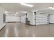 Spacious three car garage with sealed floors and modern doors at 49 Crested Cloud Way, Las Vegas, NV 89135