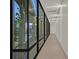 Bright hallway with large windows and rock garden at 49 Crested Cloud Way, Las Vegas, NV 89135