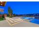 Outdoor area with hot tub and lounge area; featuring modern tile work and city views at 49 Crested Cloud Way, Las Vegas, NV 89135