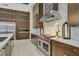 Elegant kitchen showcasing stainless steel appliances, a gas range, and custom cabinetry at 49 Crested Cloud Way, Las Vegas, NV 89135